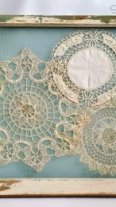 Displaying vintage antique crochet doilies in a salvaged window frame by Sadie Seasongoods / www.sadieseasongoods.com