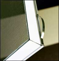 Screens are held in place with hidden spring clips on top. Remove screens from inside home.
